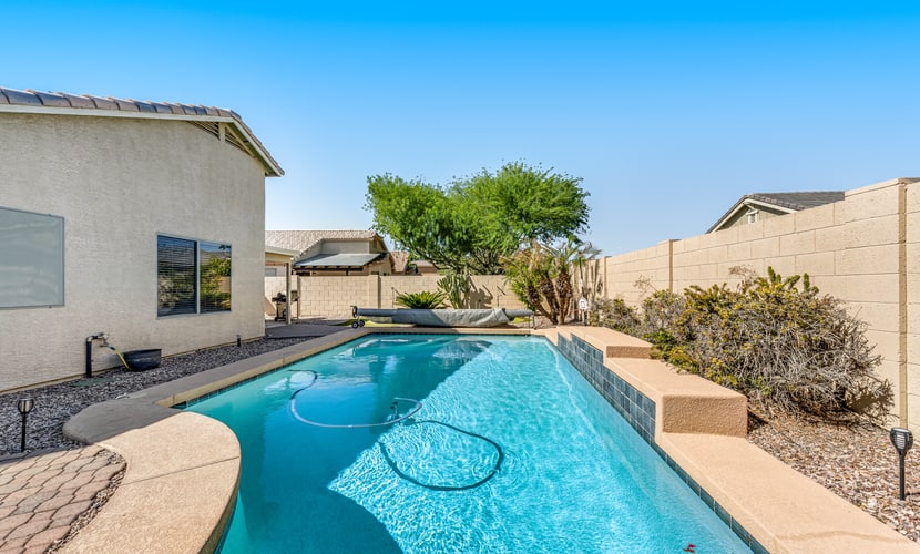 Spacious home with private heated pool with waterfall, putting green & firepit