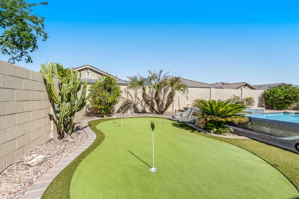 Spacious home with private heated pool with waterfall, putting green & firepit