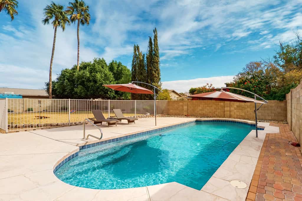 Welcoming home with private outdoor pool, pool table, patio, grill & central AC