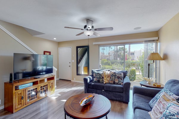 Sun-filled condo with a patio, central AC, pool & grill access - great location