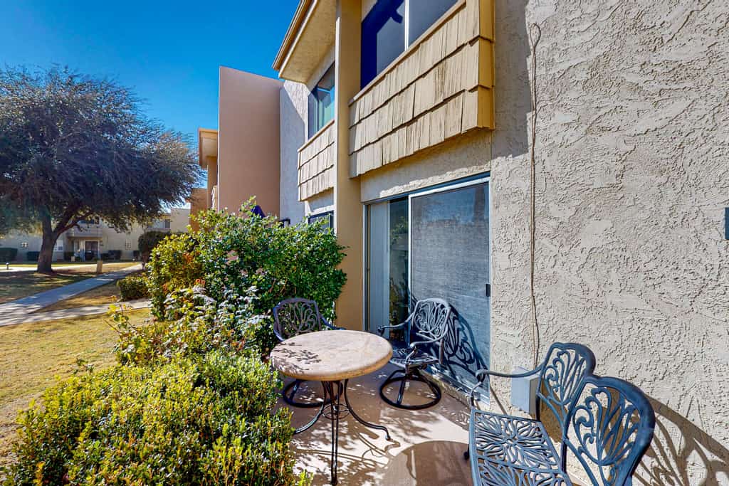 Sun-filled condo with a patio, central AC, pool & grill access - great location