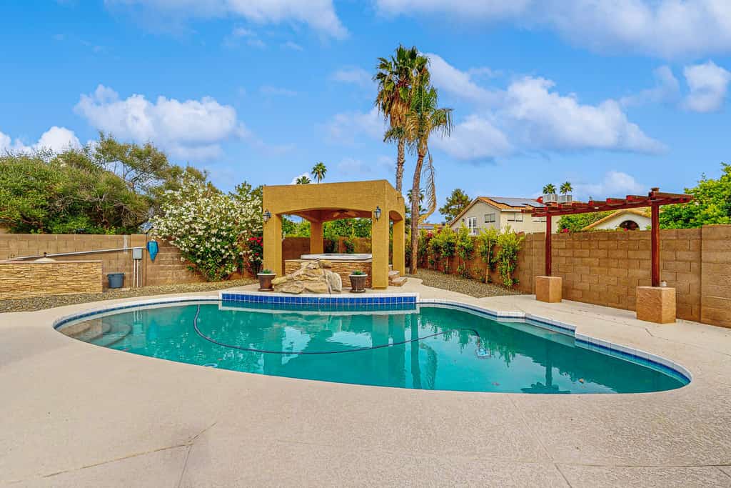 Scottsdale Style Meets Family-Friendly Fun! Spacious home with a yard and pool.