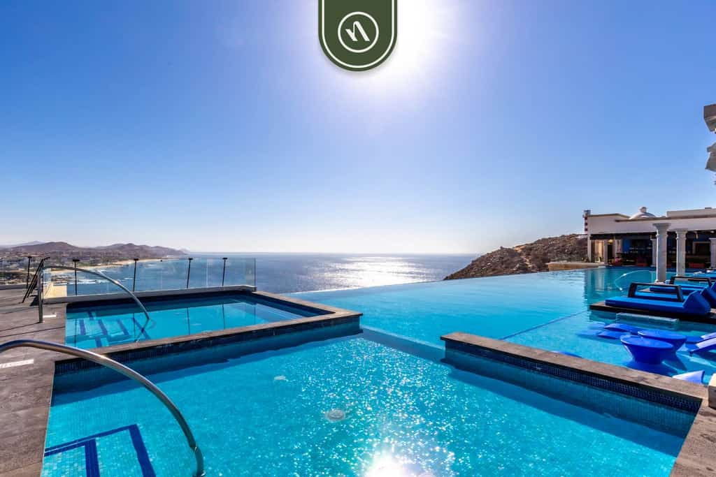 Enjoy the fantastic amenities of Hacienda Encantada Resort while experiencing the comfort and seclusion of our two-bedroom condo.

• One king-size bed, two queen beds, and a sofa bed
• Infinity pool, jacuzzi, and grill area 
• Restaurants of various specialties and bars
• Optional all-inclusive packages*
• Sports area with pickleball, tennis, and beach volleyball courts
• Wellness area
• Butler services 
• Resort access with amazing amenities 
• Private beach access 
• 24/7 security

