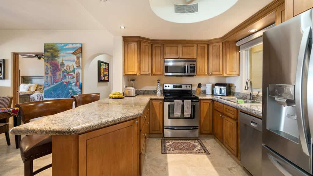 Wooden doors and light colored walls merge in a magnificent sense of Victorian-Era Mexico, intertwined with the new and awe-inspiring of the high-tech appliances.