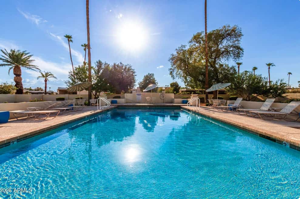 Spacious townhome with movie room, patios, pool, & home office