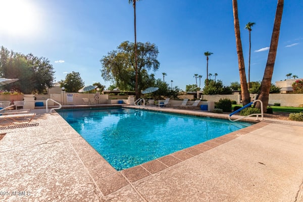 Spacious townhome with movie room, patios, pool, & home office