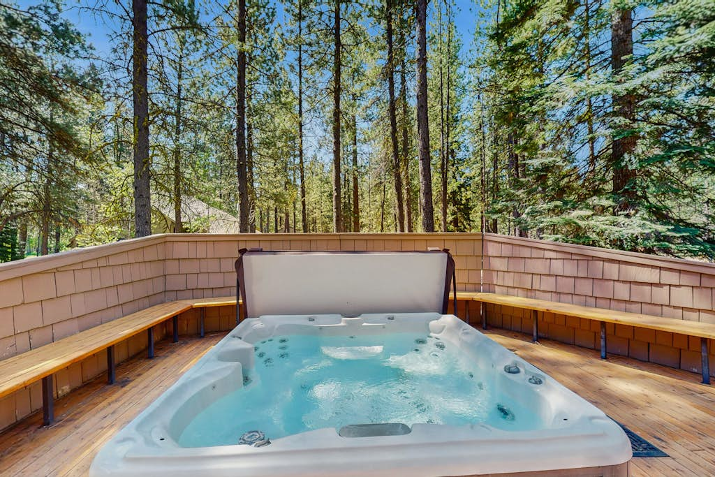 Dog-friendly cabin with pool, sauna, private hot tub, & great deck