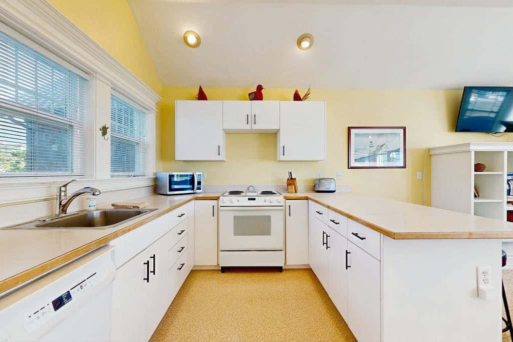 Ocean-view home with private hot tub, fireplace & grill - walk to beach