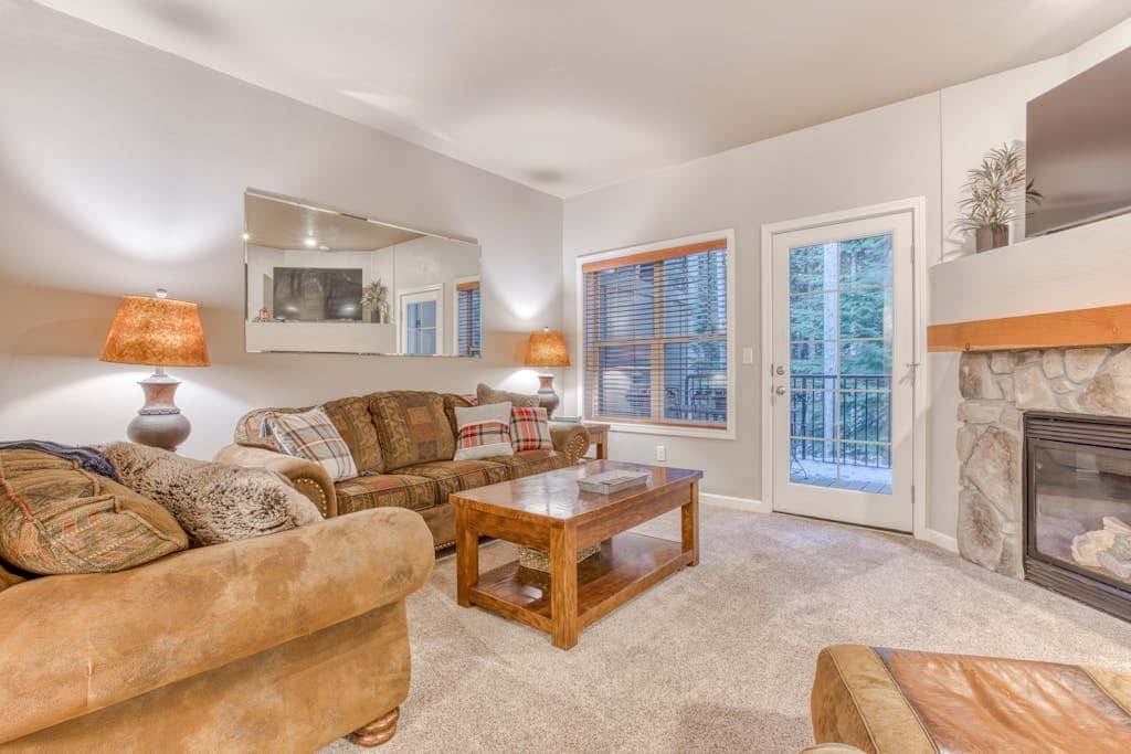 Comfortable condo with fireplace, heated pool, hot tub, balcony & full kitchen