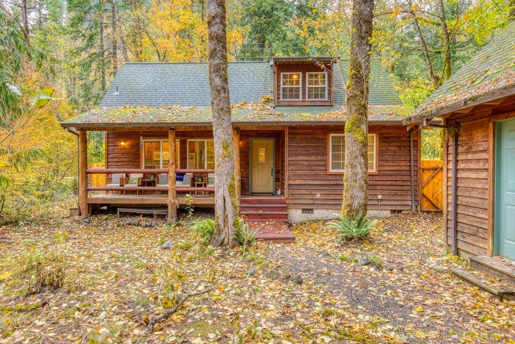 Dog-friendly cabin with deck, fenced yard, game room, & hot tub