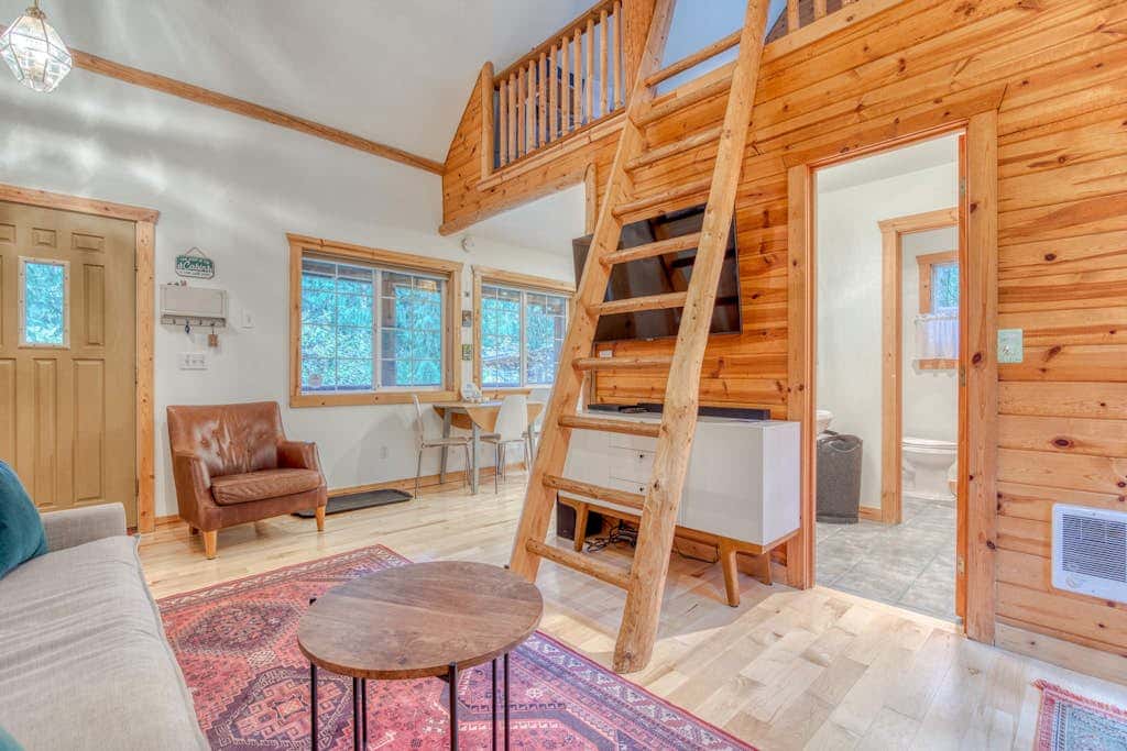 Dog-friendly cabin with deck, fenced yard, game room, & hot tub
