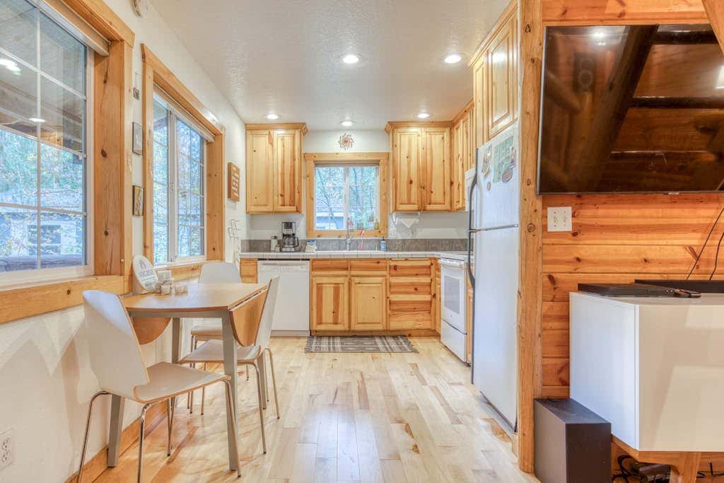 Dog-friendly cabin with deck, fenced yard, game room, & hot tub