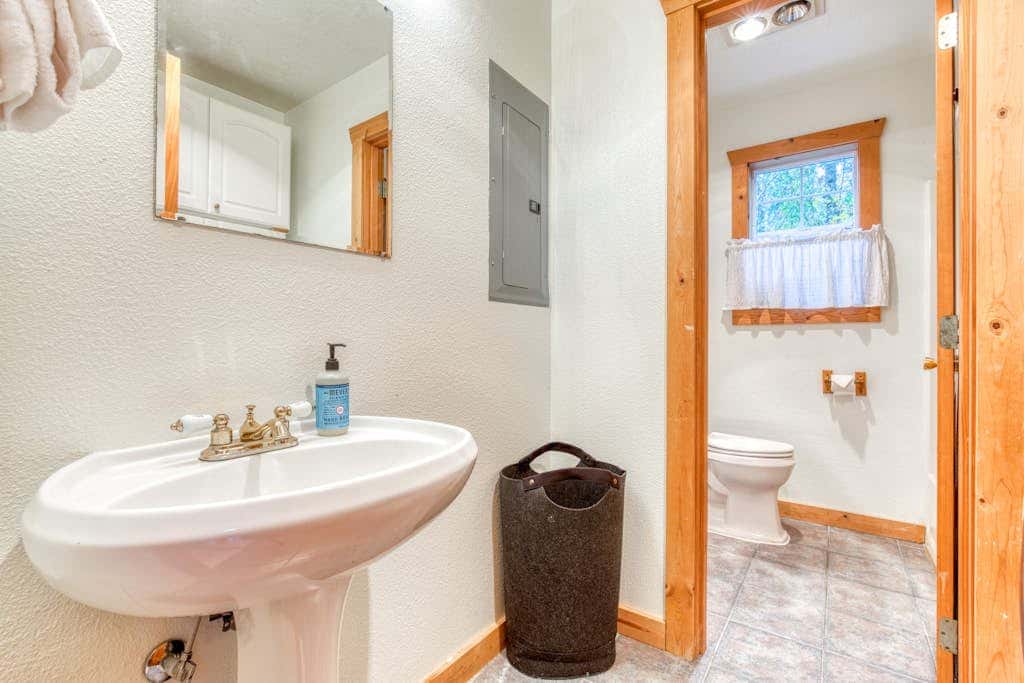 Dog-friendly cabin with deck, fenced yard, game room, & hot tub
