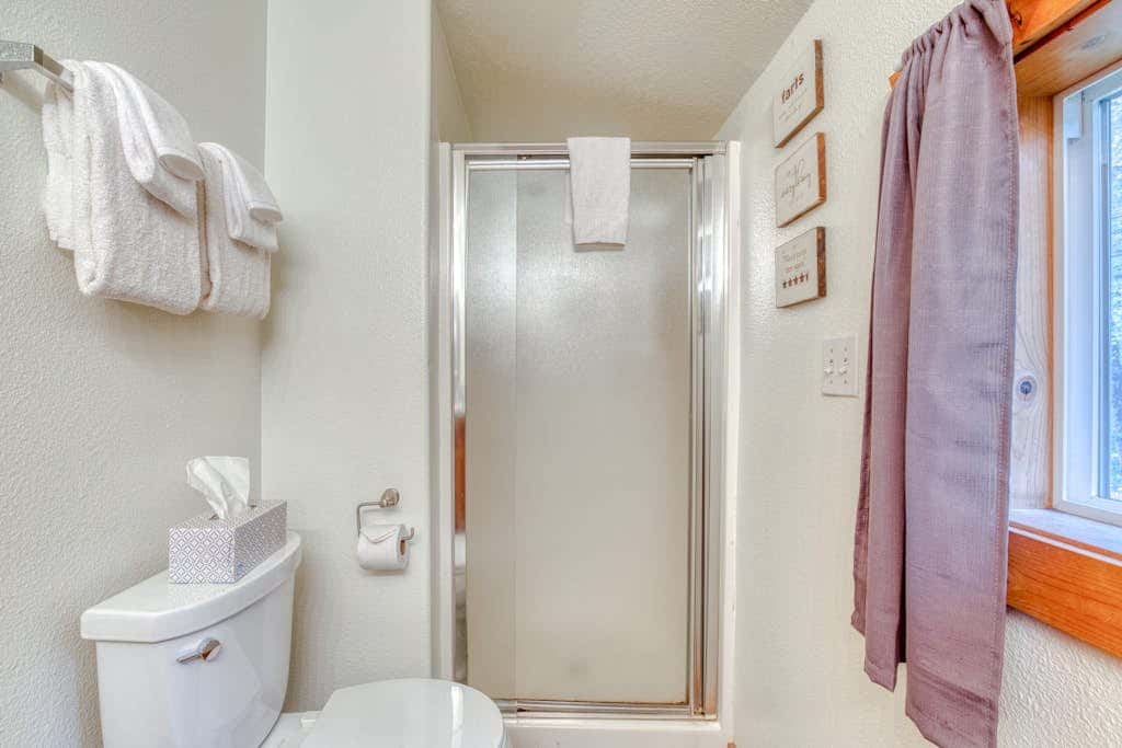 Dog-friendly cabin with deck, fenced yard, game room, & hot tub