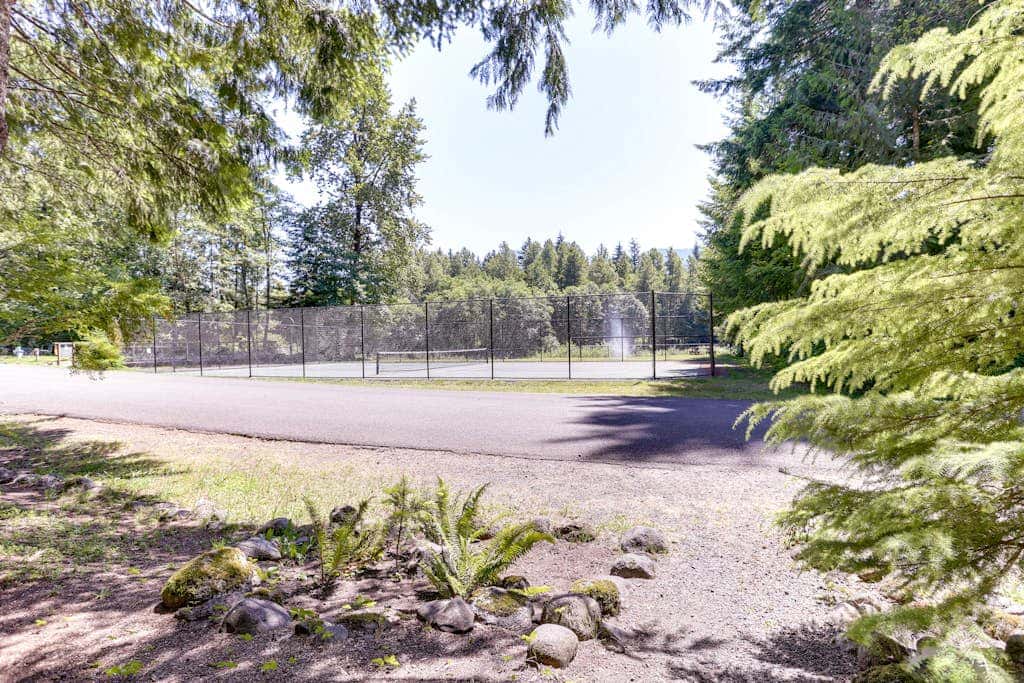 Dog-friendly cabin with deck, fenced yard, game room, & hot tub