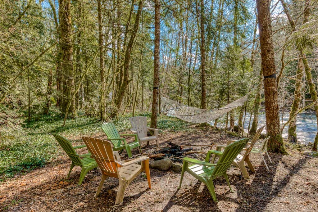 Rustic lodge with private hot tub, fireplace & riverfront views  - dog-friendly