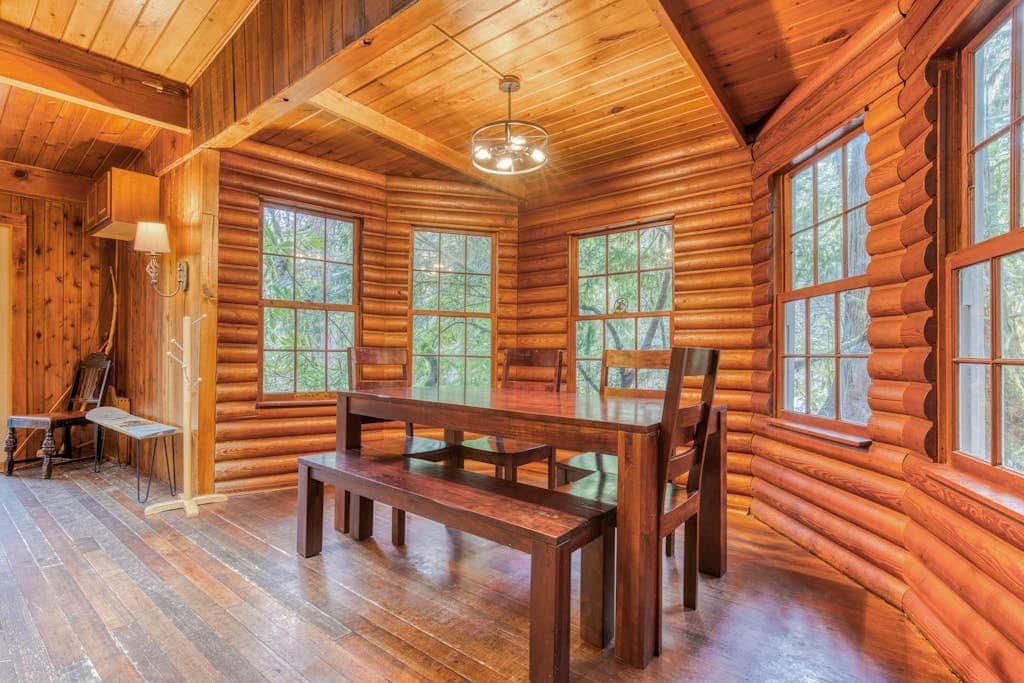 Rustic lodge with private hot tub, fireplace & riverfront views  - dog-friendly