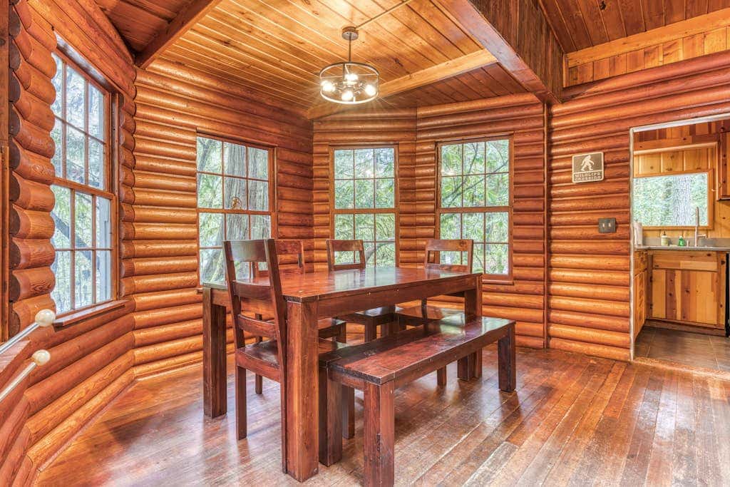Rustic lodge with private hot tub, fireplace & riverfront views  - dog-friendly