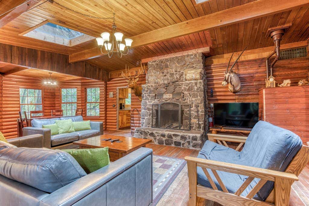 Rustic lodge with private hot tub, fireplace & riverfront views  - dog-friendly
