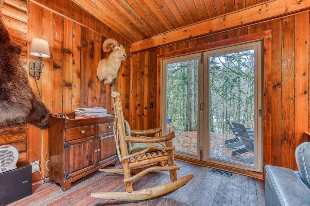 Rustic lodge with private hot tub, fireplace & riverfront views  - dog-friendly