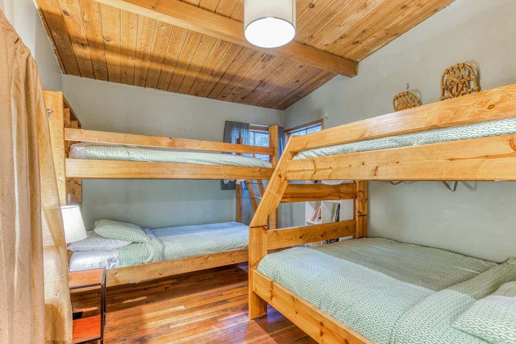 Rustic lodge with private hot tub, fireplace & riverfront views  - dog-friendly