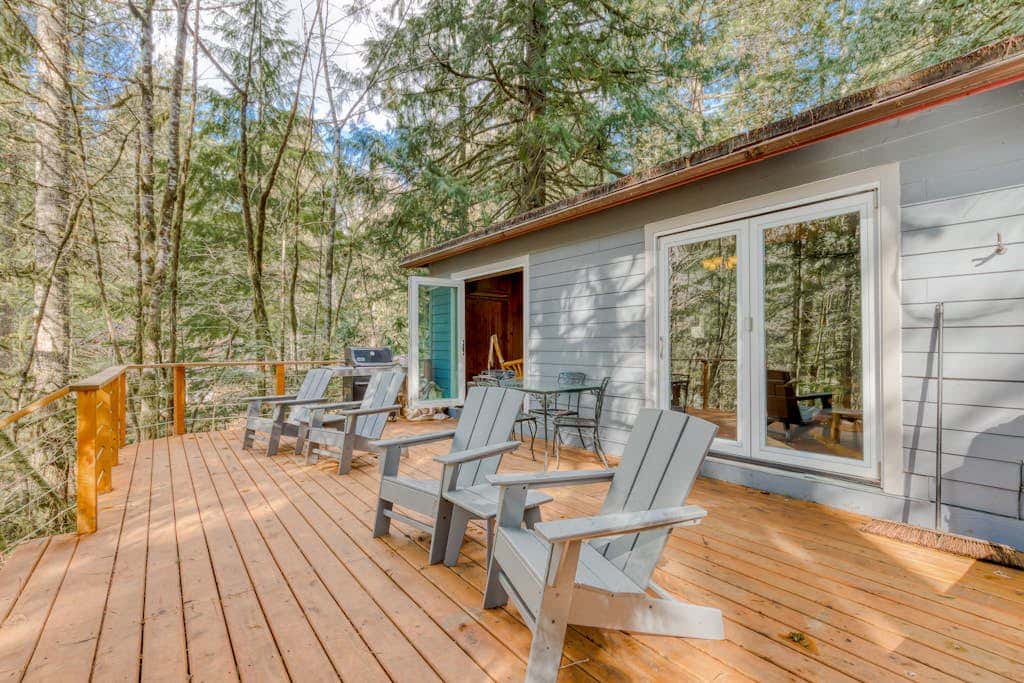 Rustic lodge with private hot tub, fireplace & riverfront views  - dog-friendly