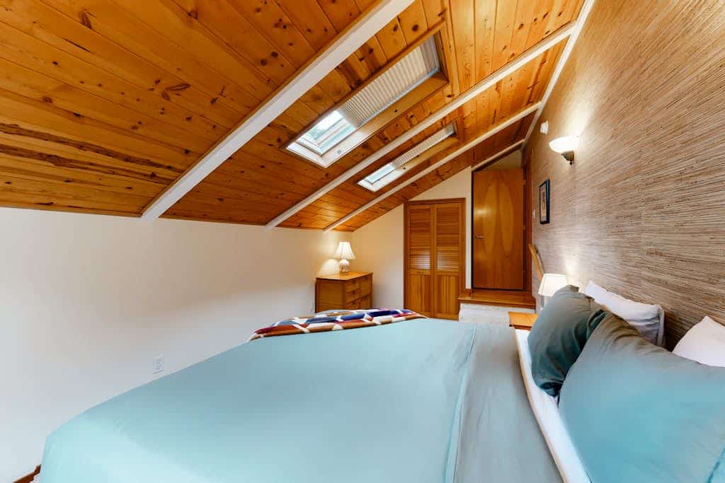 Tree-lined coastal home with wood fireplace, yard, W&D, & games
