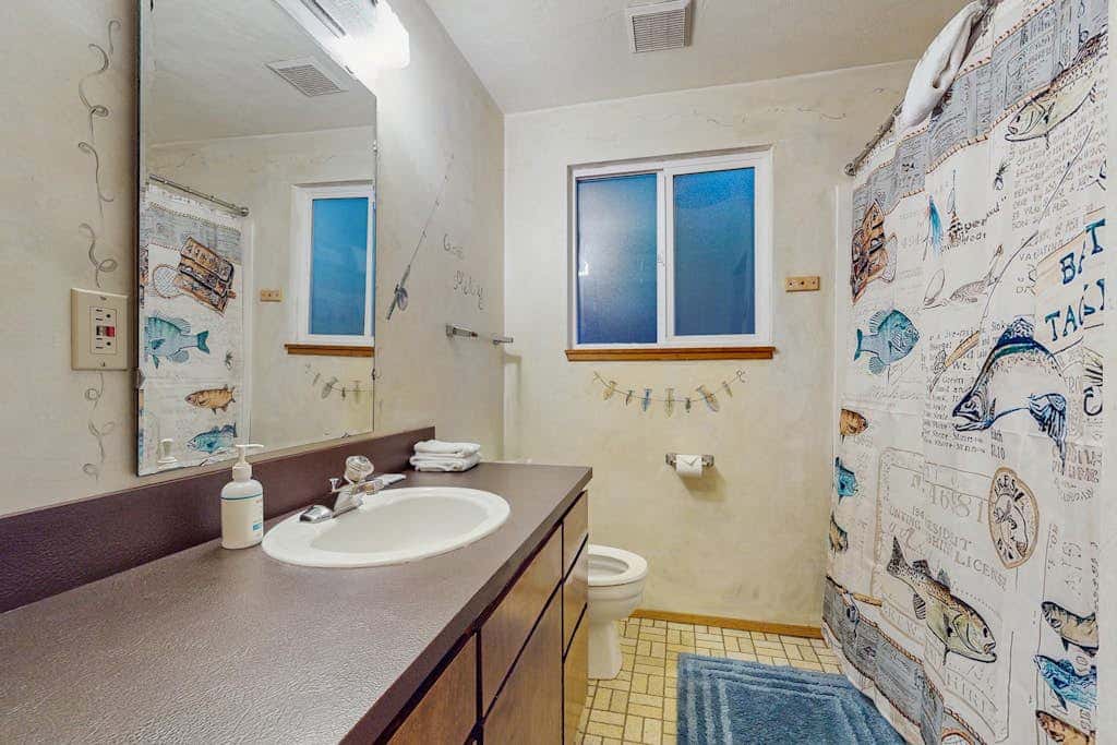 Dog-friendly lakefront home w/ convenient location & private deck