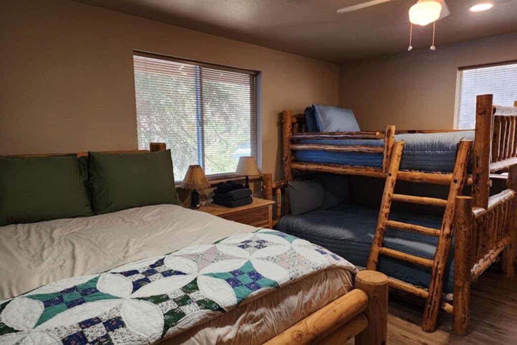 Lakefront home with wraparound deck, modern appliances, WiFI & dog-friendly