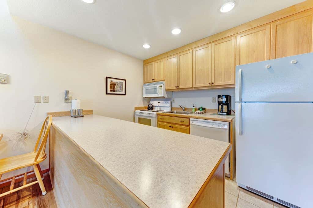 Waterfront Condo with Private Deck, Bay Views, Pool, Hot Tub, & Sauna