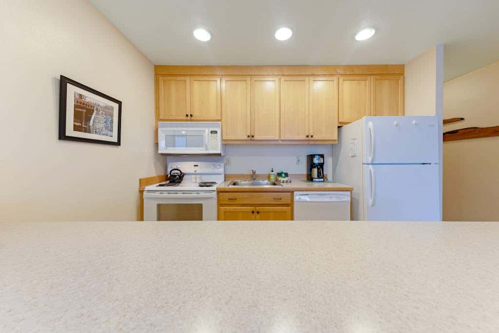 Waterfront Condo with Private Deck, Bay Views, Pool, Hot Tub, & Sauna