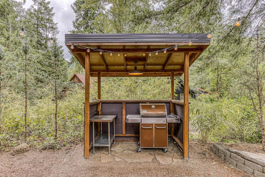 Dog-friendly home with hot tub, shared pool, firepit, fireplace, & river access