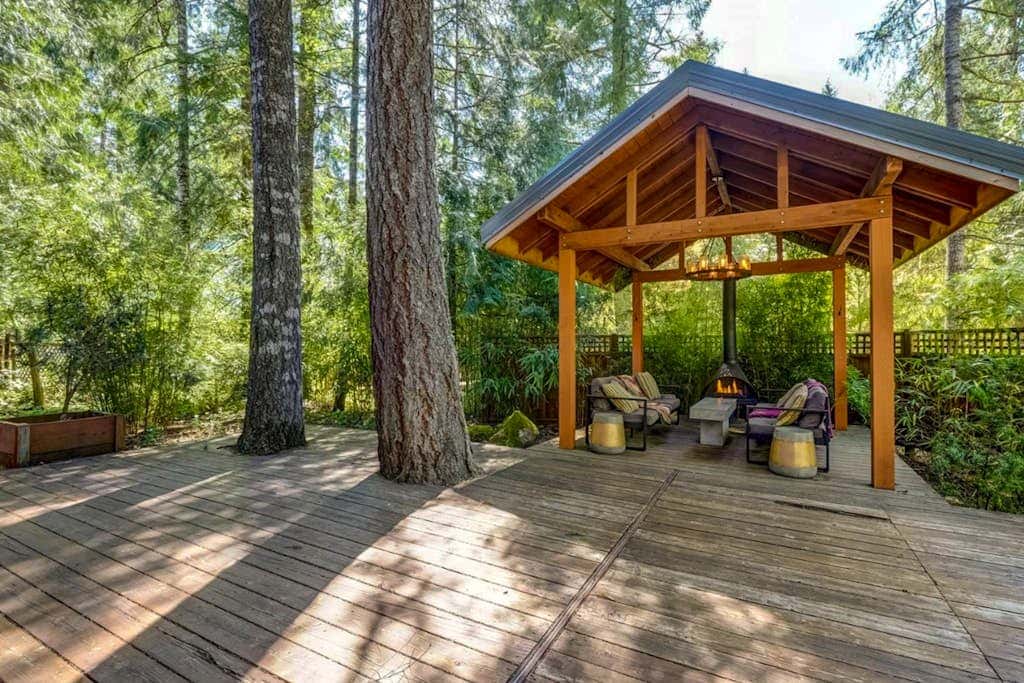 Dog-friendly home with hot tub, shared pool, firepit, fireplace, & river access