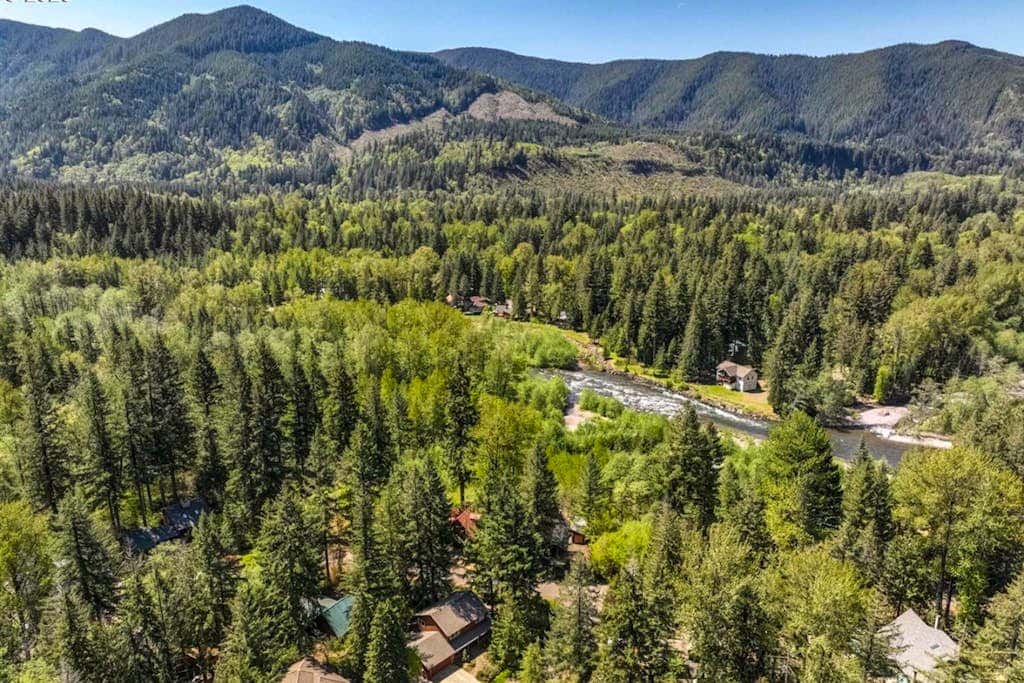 Dog-friendly home with hot tub, shared pool, firepit, fireplace, & river access