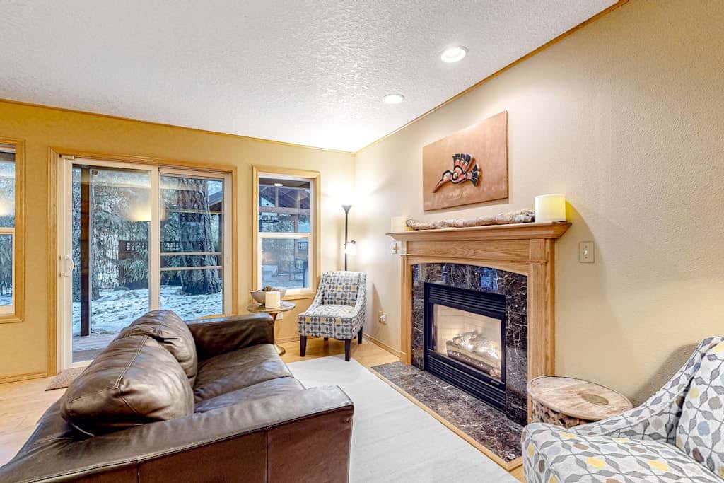 Dog-friendly home with hot tub, shared pool, firepit, fireplace, & river access
