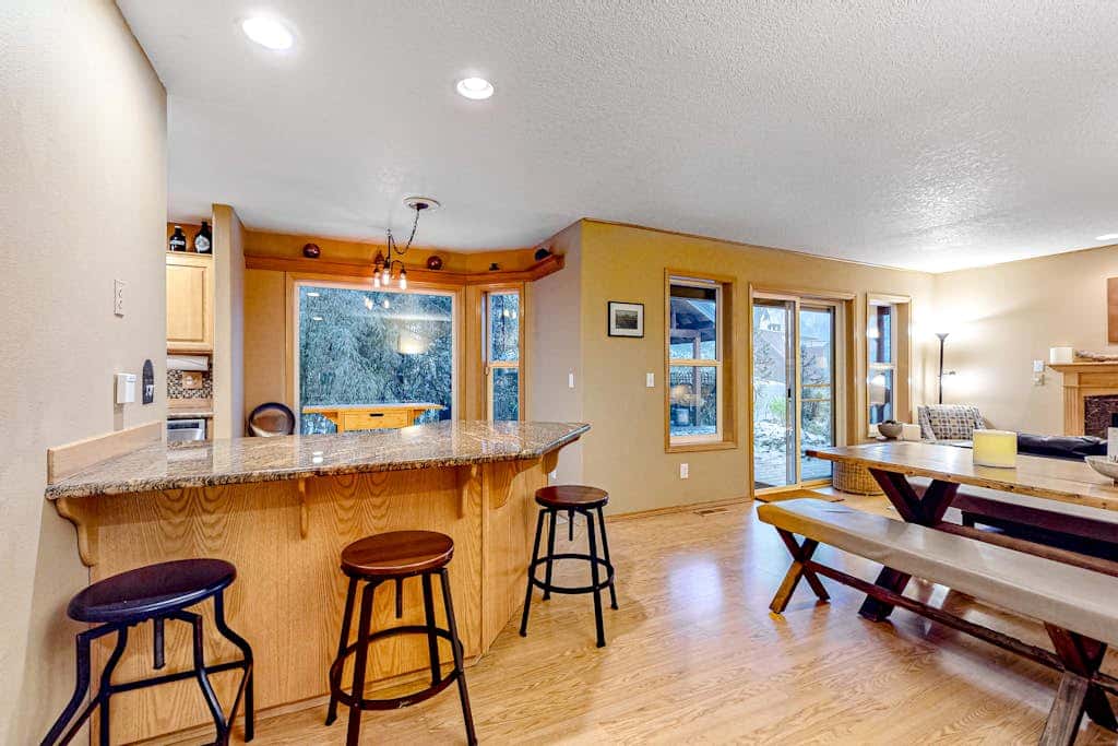 Dog-friendly home with hot tub, shared pool, firepit, fireplace, & river access