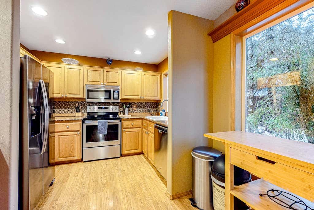 Dog-friendly home with hot tub, shared pool, firepit, fireplace, & river access