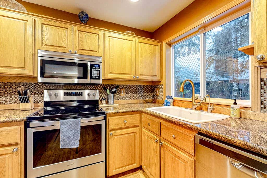 Dog-friendly home with hot tub, shared pool, firepit, fireplace, & river access