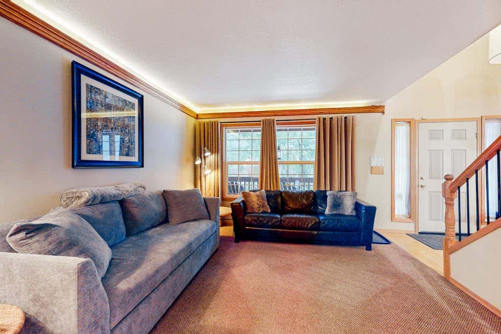 Dog-friendly home with hot tub, shared pool, firepit, fireplace, & river access