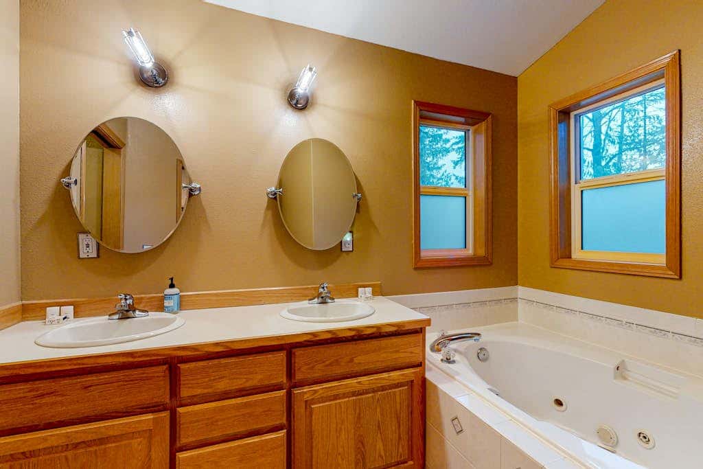 Dog-friendly home with hot tub, shared pool, firepit, fireplace, & river access