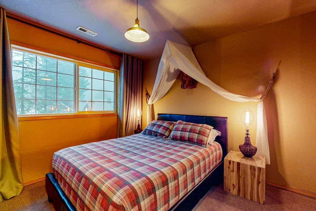 Dog-friendly home with hot tub, shared pool, firepit, fireplace, & river access