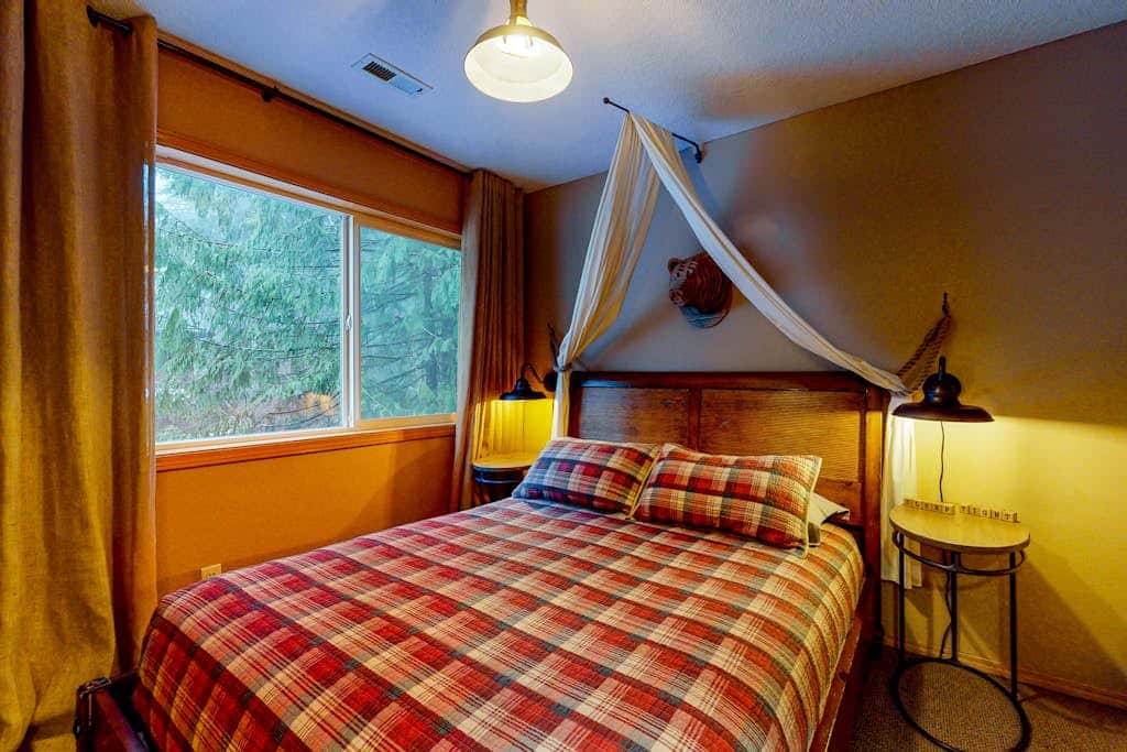 Dog-friendly home with hot tub, shared pool, firepit, fireplace, & river access
