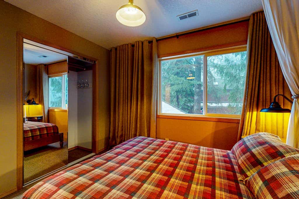 Dog-friendly home with hot tub, shared pool, firepit, fireplace, & river access
