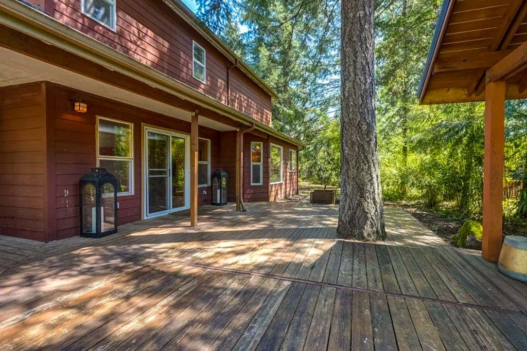 Dog-friendly home with hot tub, shared pool, firepit, fireplace, & river access