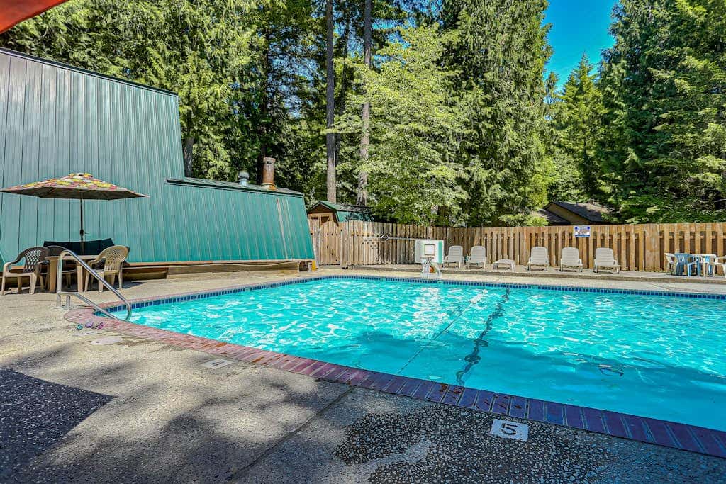 Dog-friendly home with hot tub, shared pool, firepit, fireplace, & river access