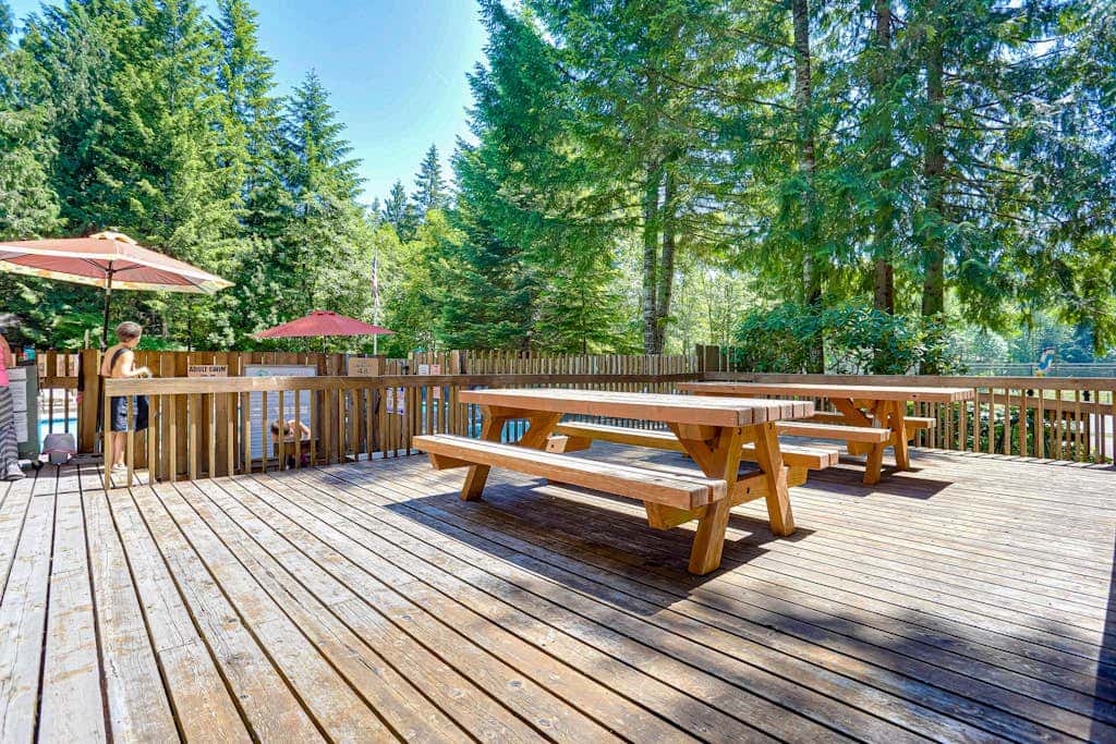 Dog-friendly home with hot tub, shared pool, firepit, fireplace, & river access
