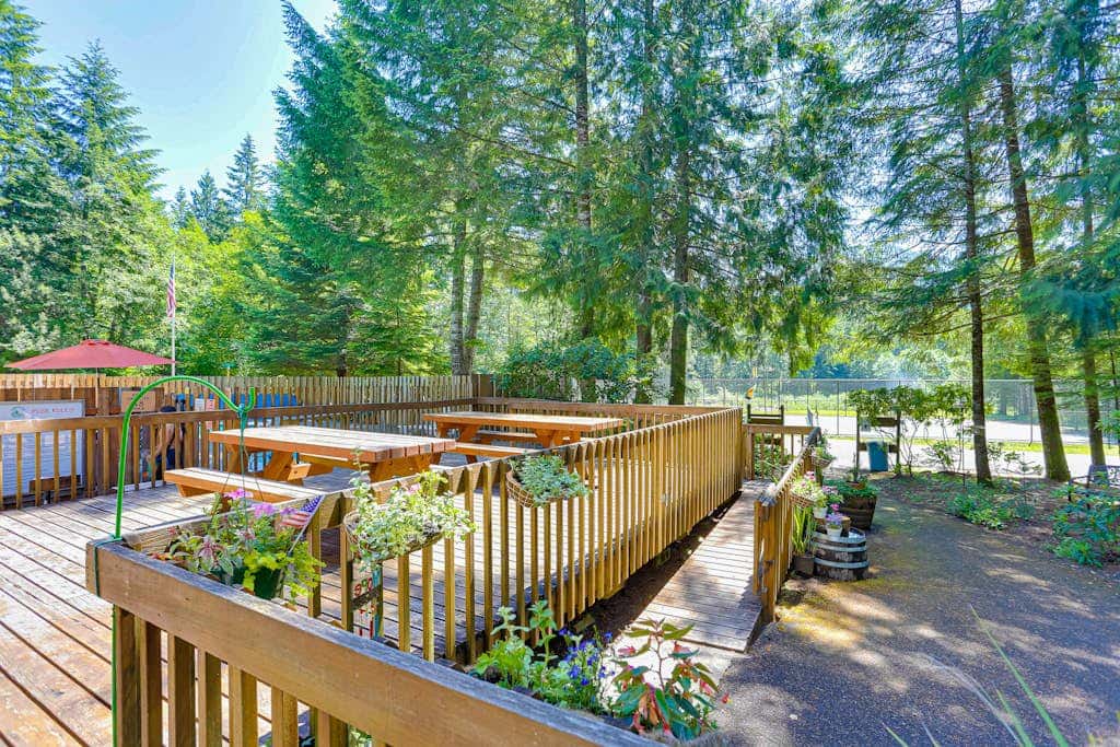 Dog-friendly home with hot tub, shared pool, firepit, fireplace, & river access