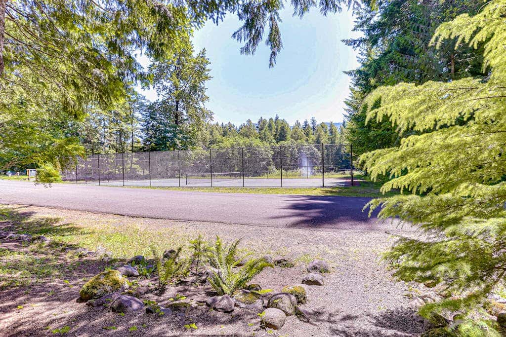 Dog-friendly home with hot tub, shared pool, firepit, fireplace, & river access