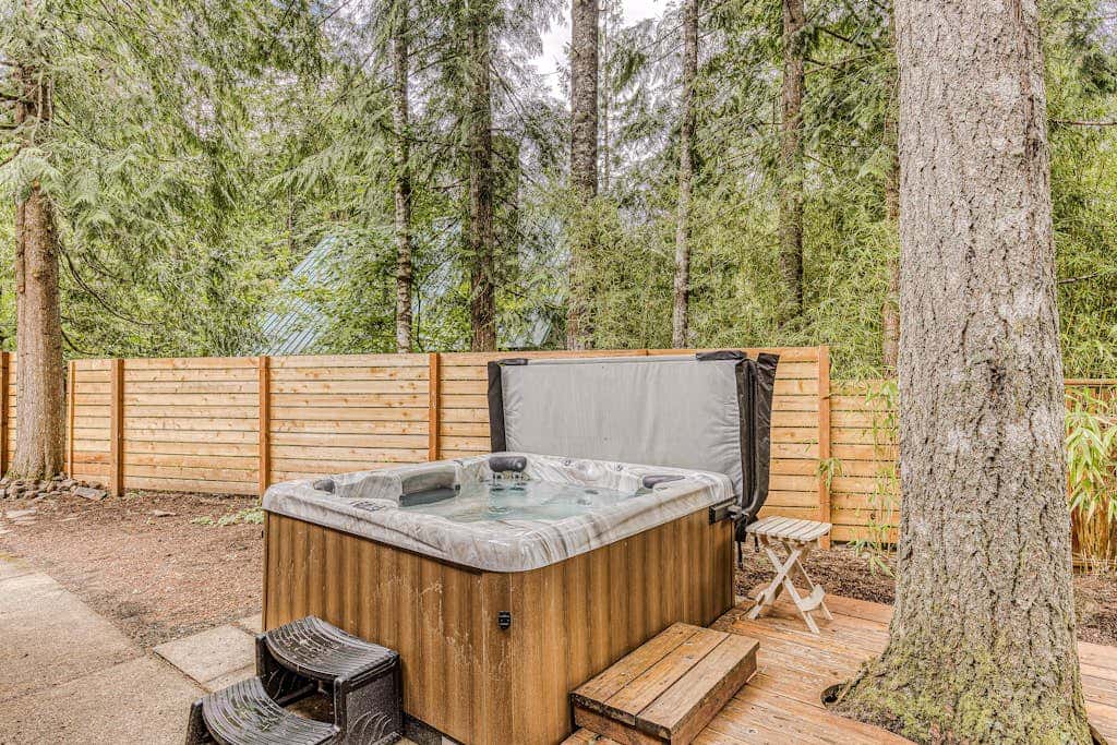 Dog-friendly home with hot tub, shared pool, firepit, fireplace, & river access