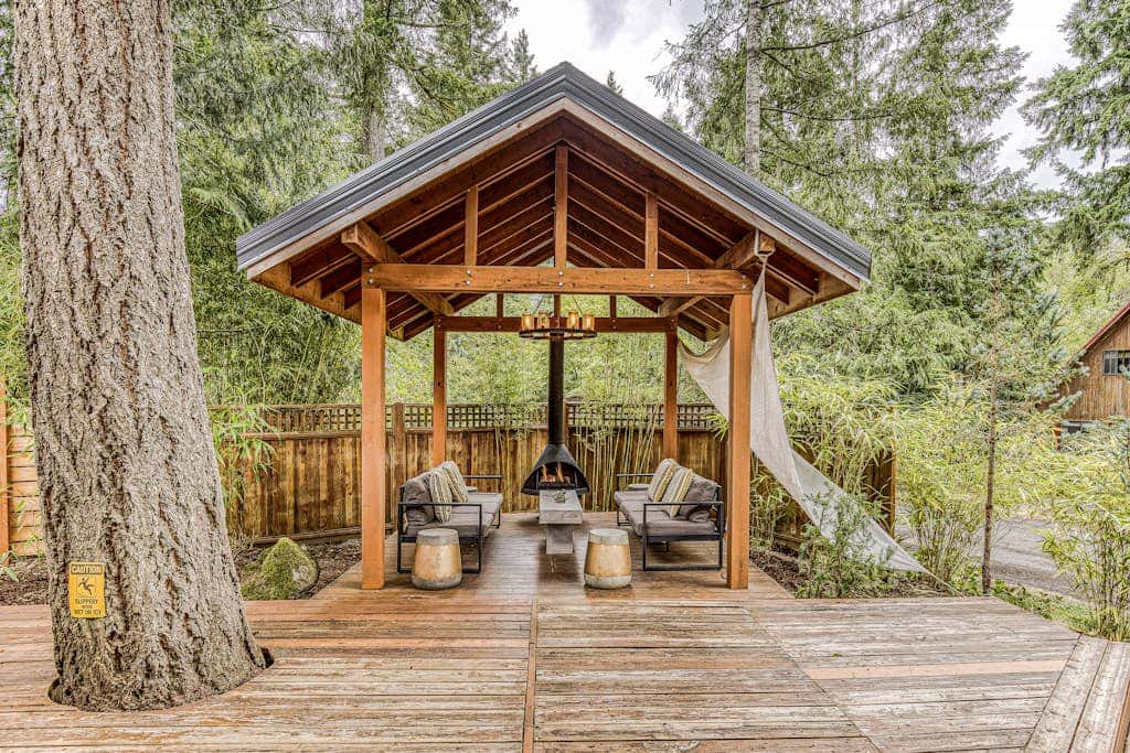 Dog-friendly home with hot tub, shared pool, firepit, fireplace, & river access